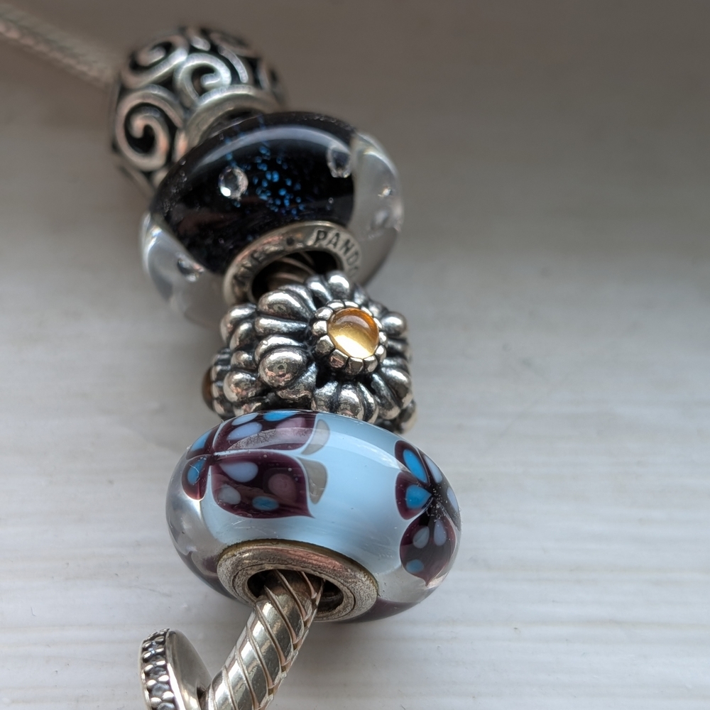 Pandora Bracelet with Charms: Blue Glass and Silver Floral Accents - Picture 2 of 7